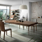 Walnut wood dining table and tempered glass